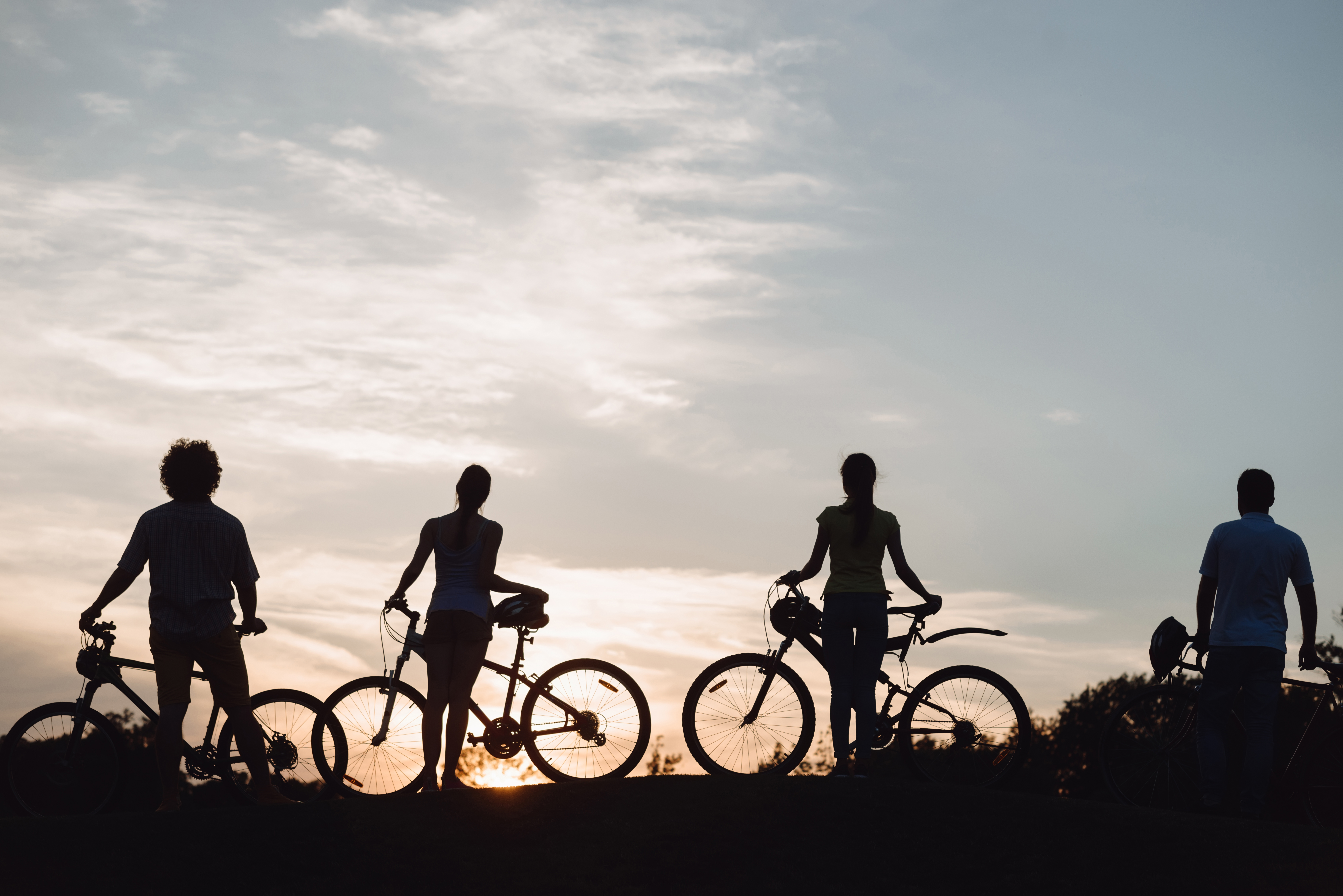 four-young-cyclists-at-beautiful-sunset-2021-09-04-16-05-54-utc